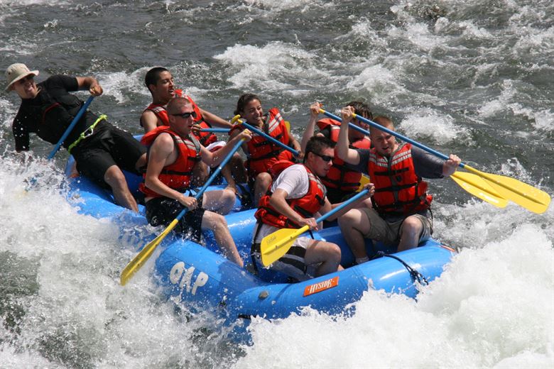 Photo of people rafting in yellow tube as a recreational activity