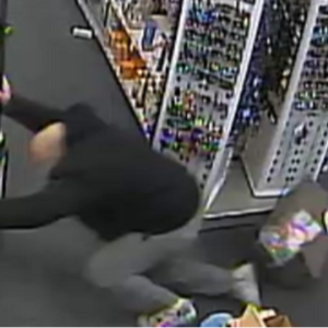 CVS Merchandise Boxes Create Serious Tripping Hazards and man in black sweatshirt trips over a cvs tote box